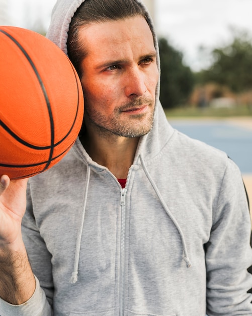 Front view of boy with basketball ball