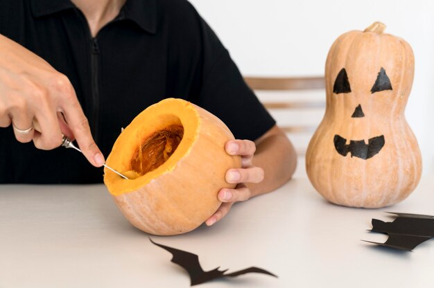 Front view of boy with pumpkin costume concept