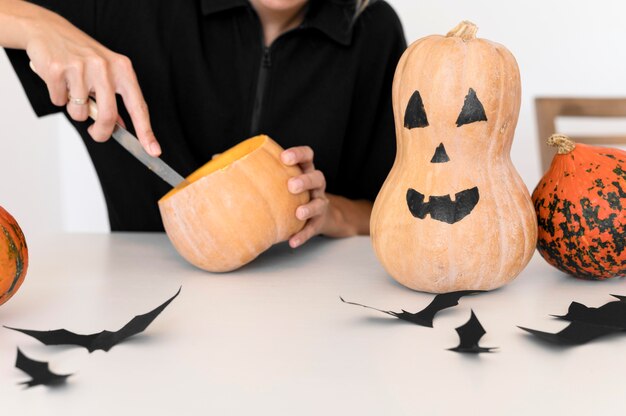 Front view of boy with pumpkin costume concept