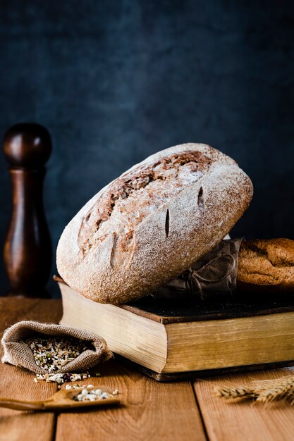 Front view of bread on a boon on wooden table