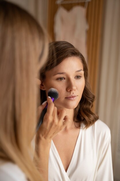 Front view bride getting ready indoors