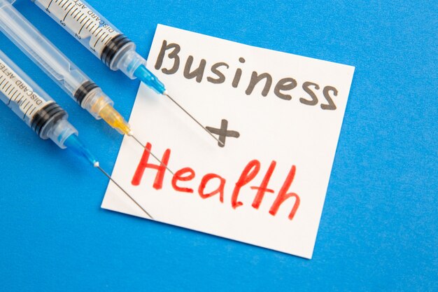 front view business health with injections on blue background