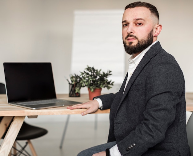 Front view of business man at desk