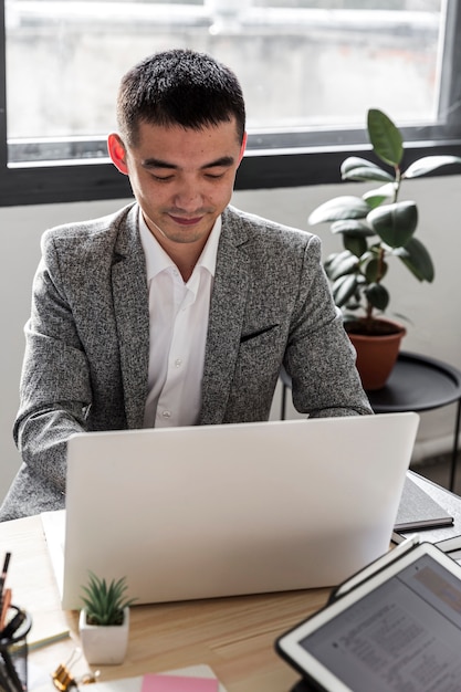 Front view of business man at desk