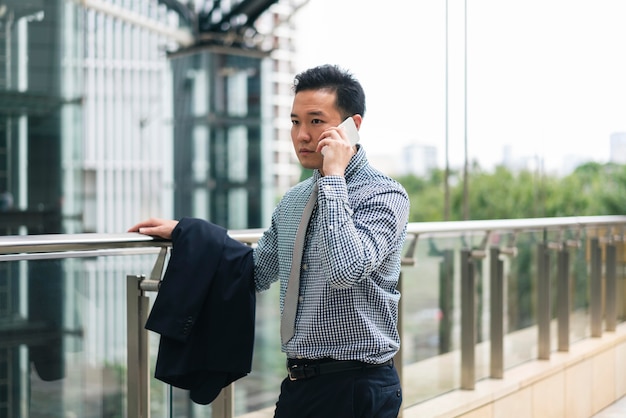 Front view of business man talking on phone