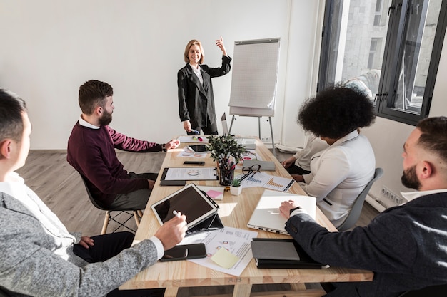 Free photo front view of business people in meeting