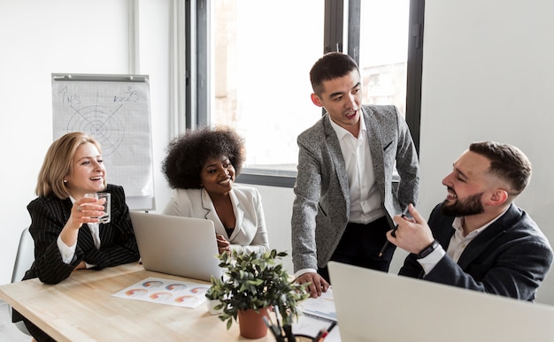 Free photo front view of business people in meeting