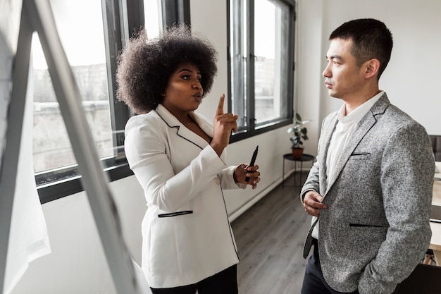 Free photo front view of business people talking