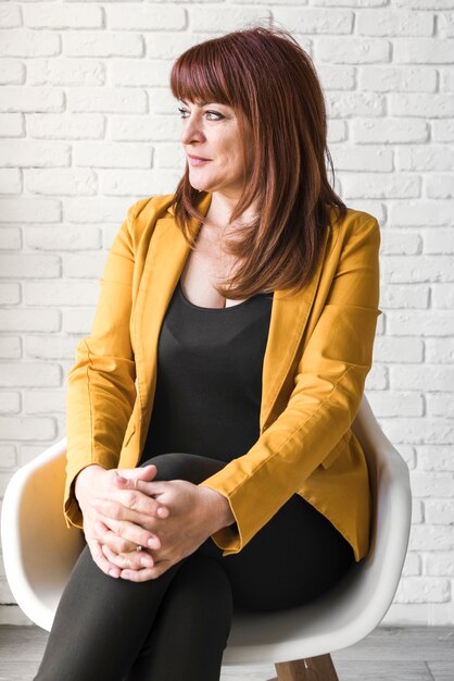 Front view business woman on chair