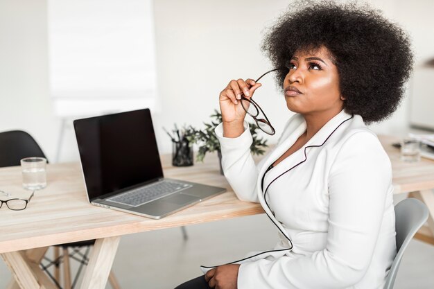 Front view of business woman at desk