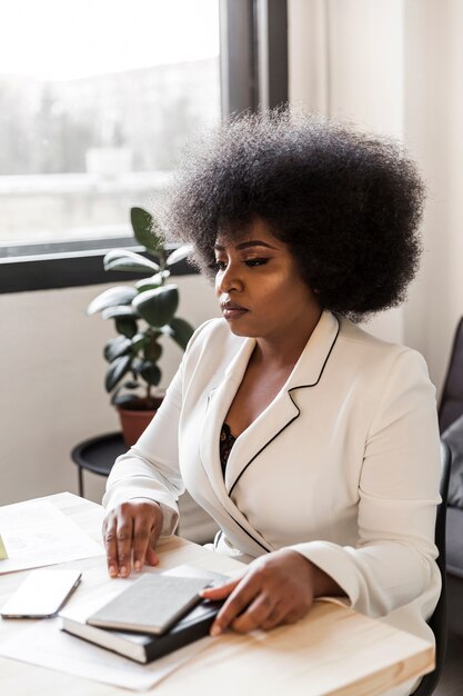 Front view of business woman at desk