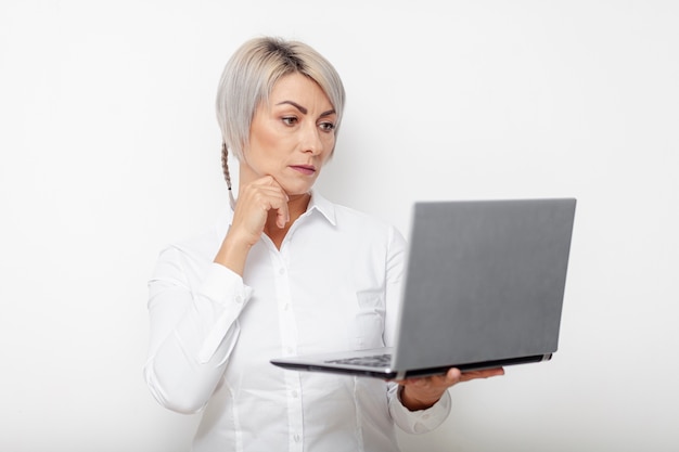 Front view business woman holding laptop