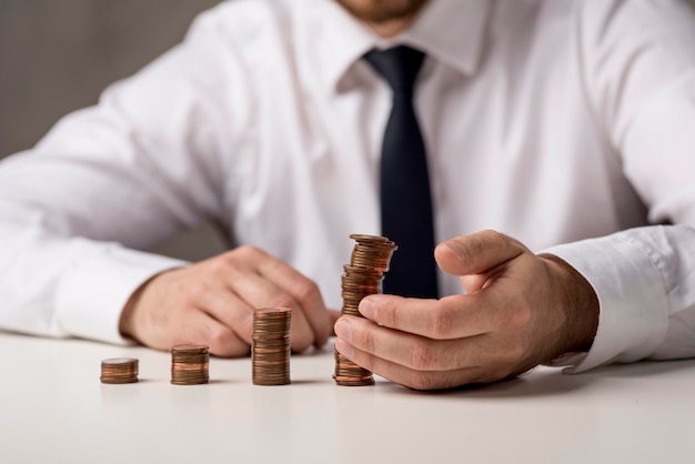 Front view of businessman with coins