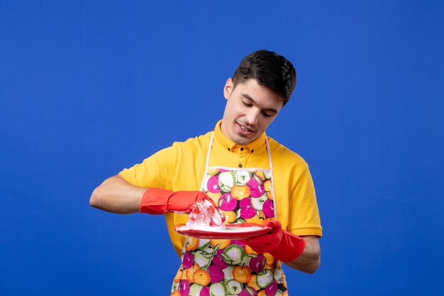 Front view busy housekeeper washing plate on blue space