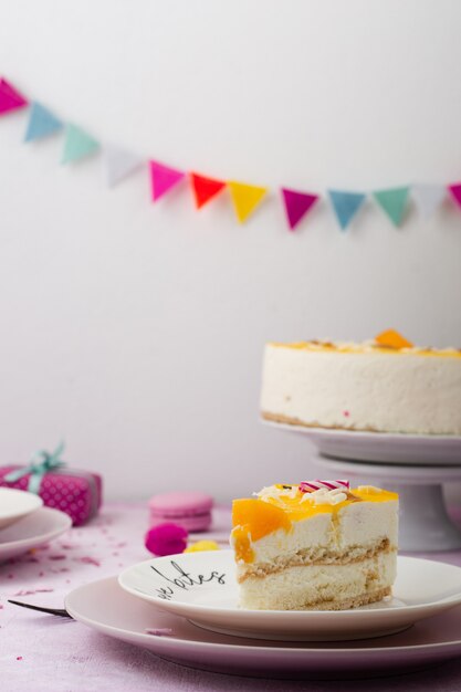 Front view of cake slice on plate with garland