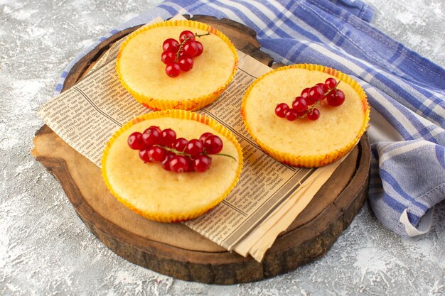 Front view of cake with cranberries yummy on the light surface