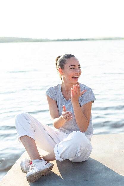 Front view carefree woman posing and looking away