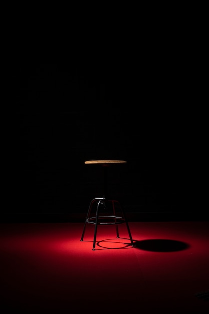 Free photo front view of chair with copy space and spotlight