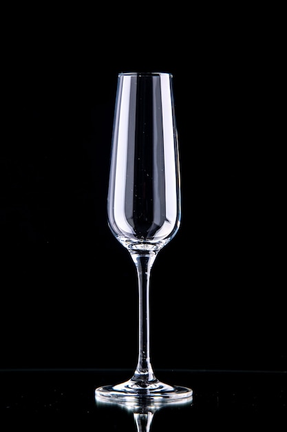 Front view champagne flute on black surface