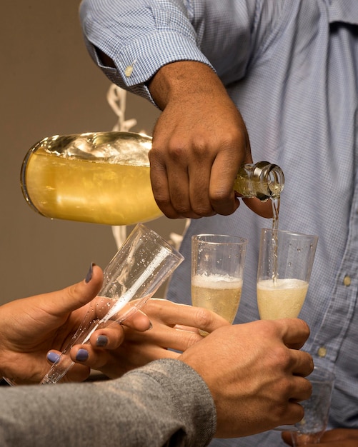 Free photo front view of champagne in glass on new year