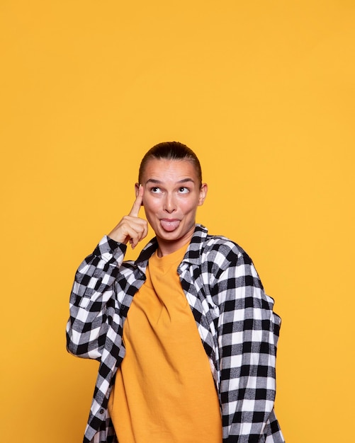 Front view of cheeky woman with checkered shirt