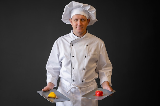 Free photo front view chef holding food plates