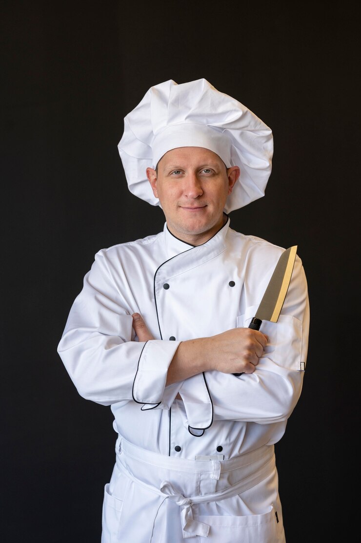 Free Photo front view chef holding knife
