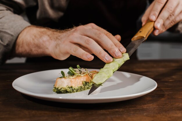 Front view chef plating meal