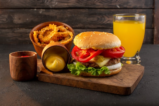 Free photo a front view chicken burger with cheese and green salad on the wooden desk and sandwich fast-food meal food