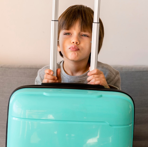 Free photo front view of child with luggage