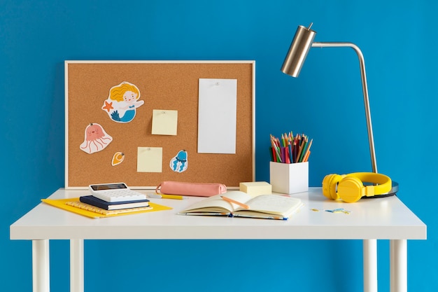 Front view of children's desk with lamp and notebook