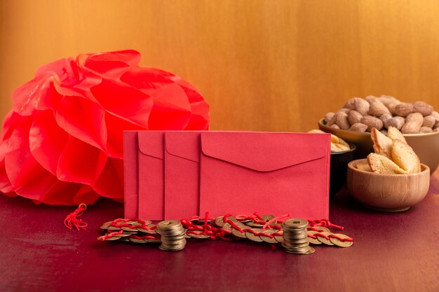 Front view of chinese new year envelopes with lantern and coins