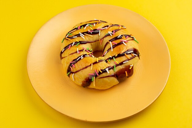 front view choco donuts yummy inside plate on the yellow floor