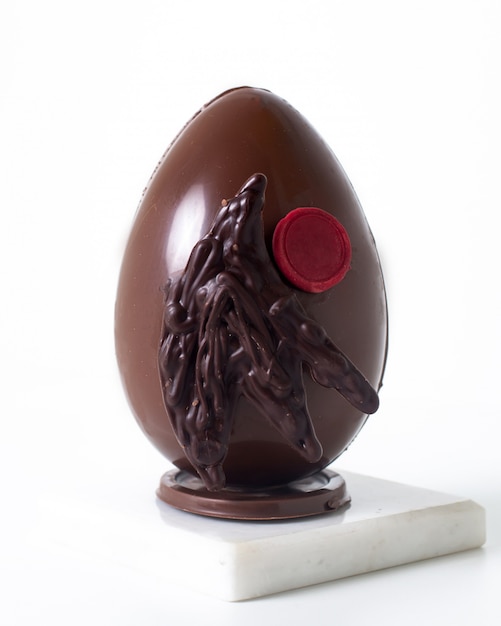 Front view choco egg on the white desk