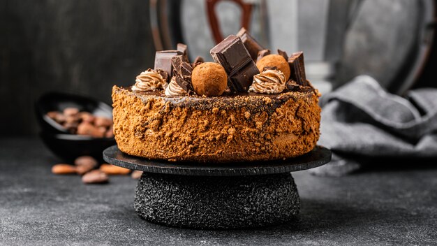 Front view of chocolate cake on stand