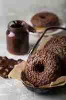 Free photo front view chocolate doughnuts arrangement