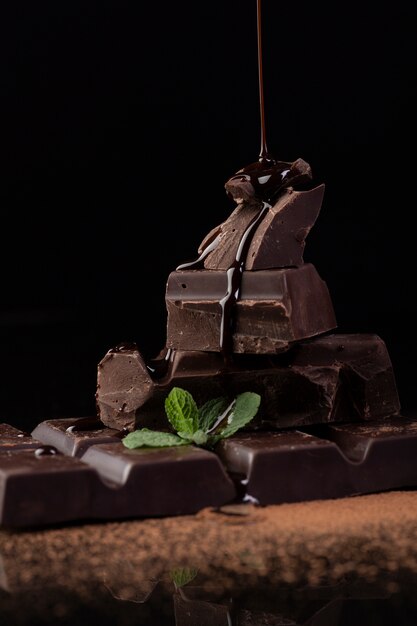 Front view of chocolate sauce pouring
