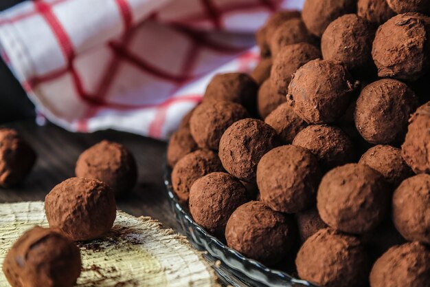 Front view chocolates in cocoa on a plate