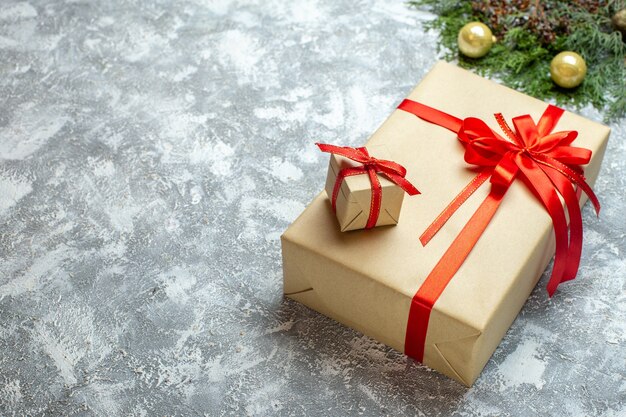 Front view christmas presents with red bows on white background