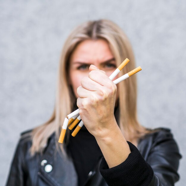 Free photo front view of cigarette bad habit concept