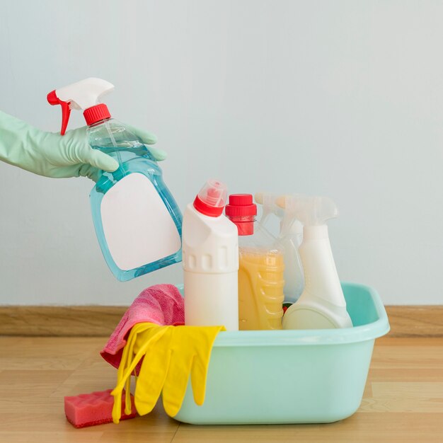 Front view of cleaning supplies in bucket