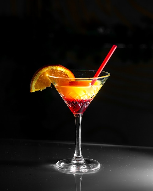 Front view cocktail with a slice of orange