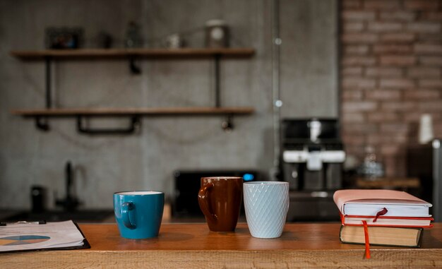 Front view of coffee mugs on table counter