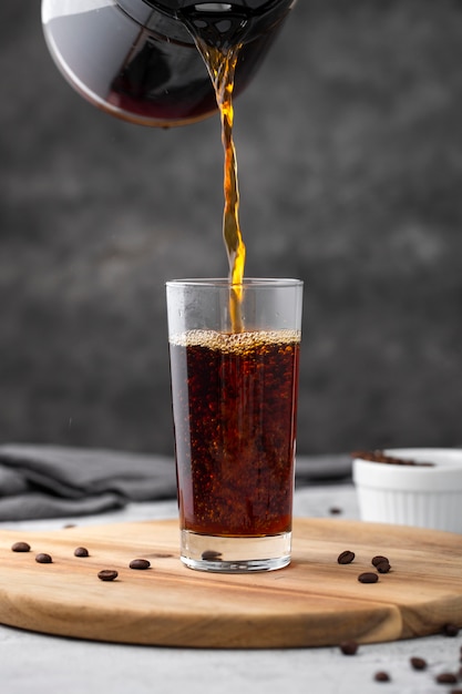 Front view coffee poured in glass