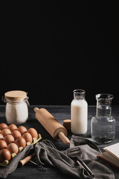 Front view collection of ingredients and tools for dough composition