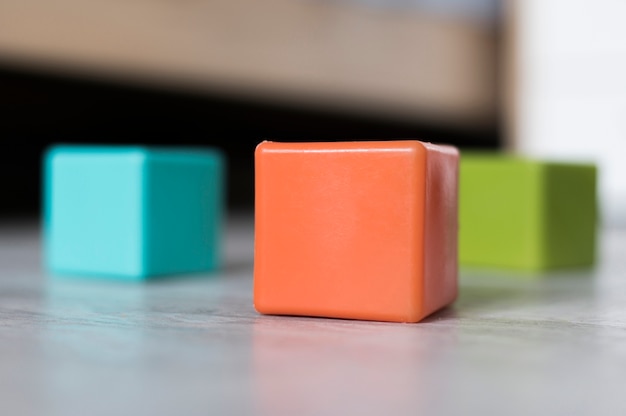 Front view of colored cubes on floor