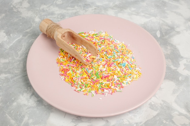 Free photo front view of colorful little candies inside plate