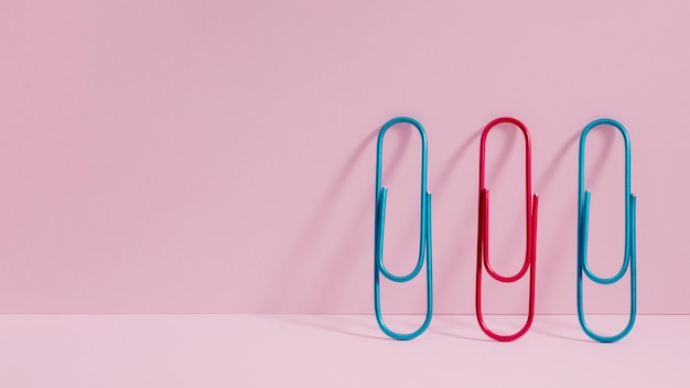 Free photo front view colourful paper clips with copy space