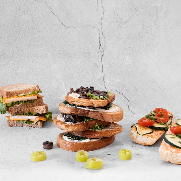 Free photo front view composition of delicious sandwiches