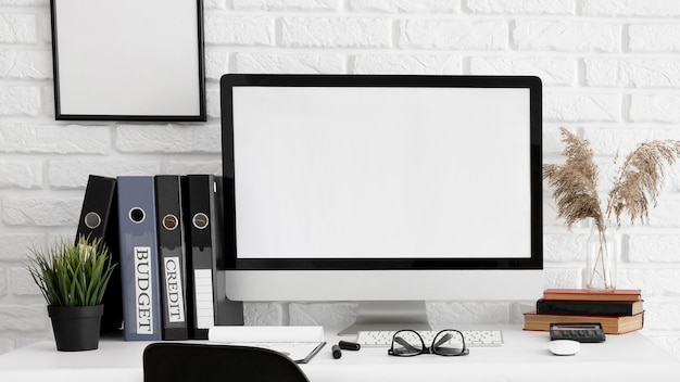 Front view of computer screen on office workspace